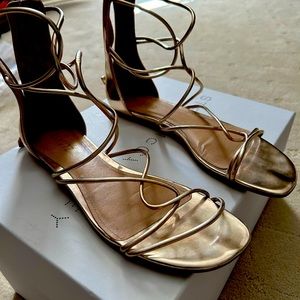 Schultz sandal size 9.5 b in gold color